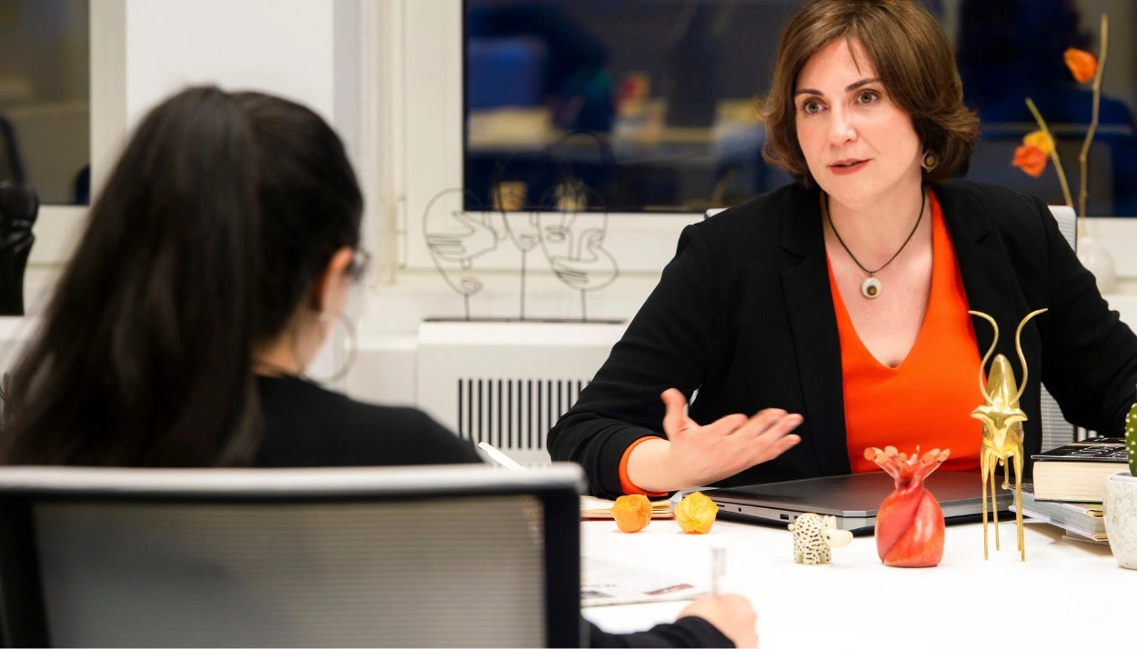 Laura helping a new communicator in her career