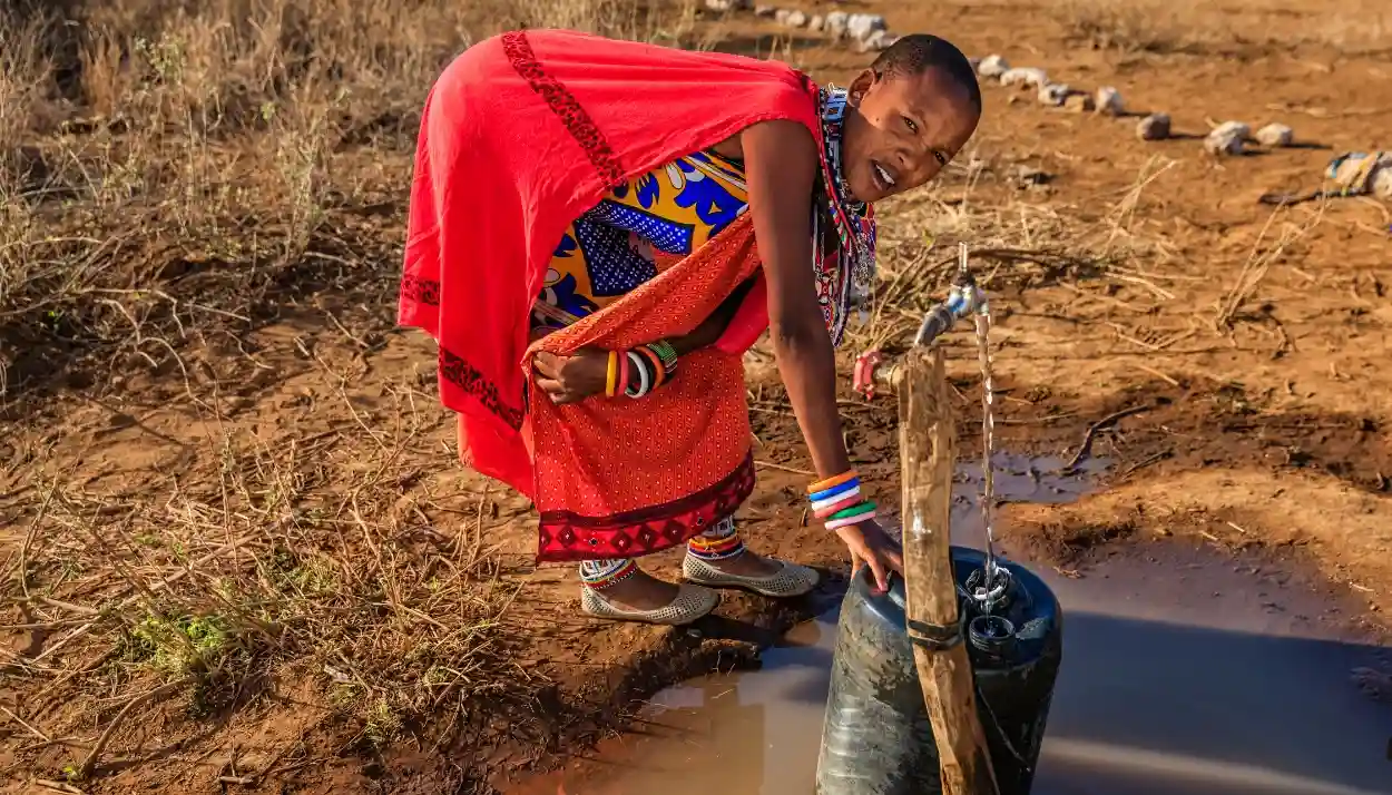 a woman pickin water in africa