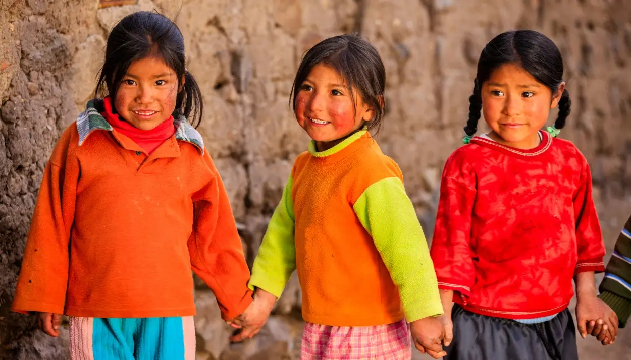 photo for an ngo of three girls form Perú