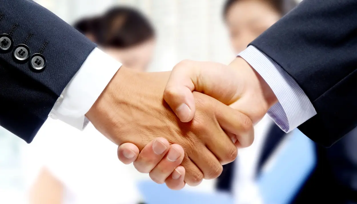 two people shaking hands