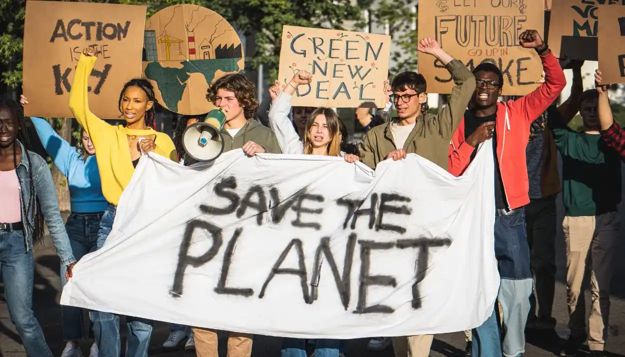 a group of people on the street demonstrating to save the environment