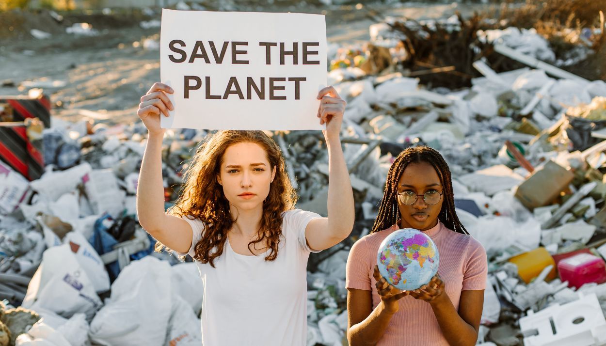 two young girls with a ‘Save the Planet’ poster as part of a storytelling marketing campaign.